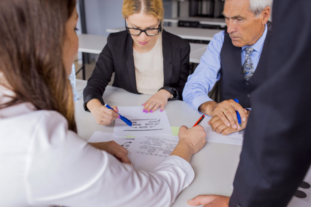 group business people discussing business plan table office scaled